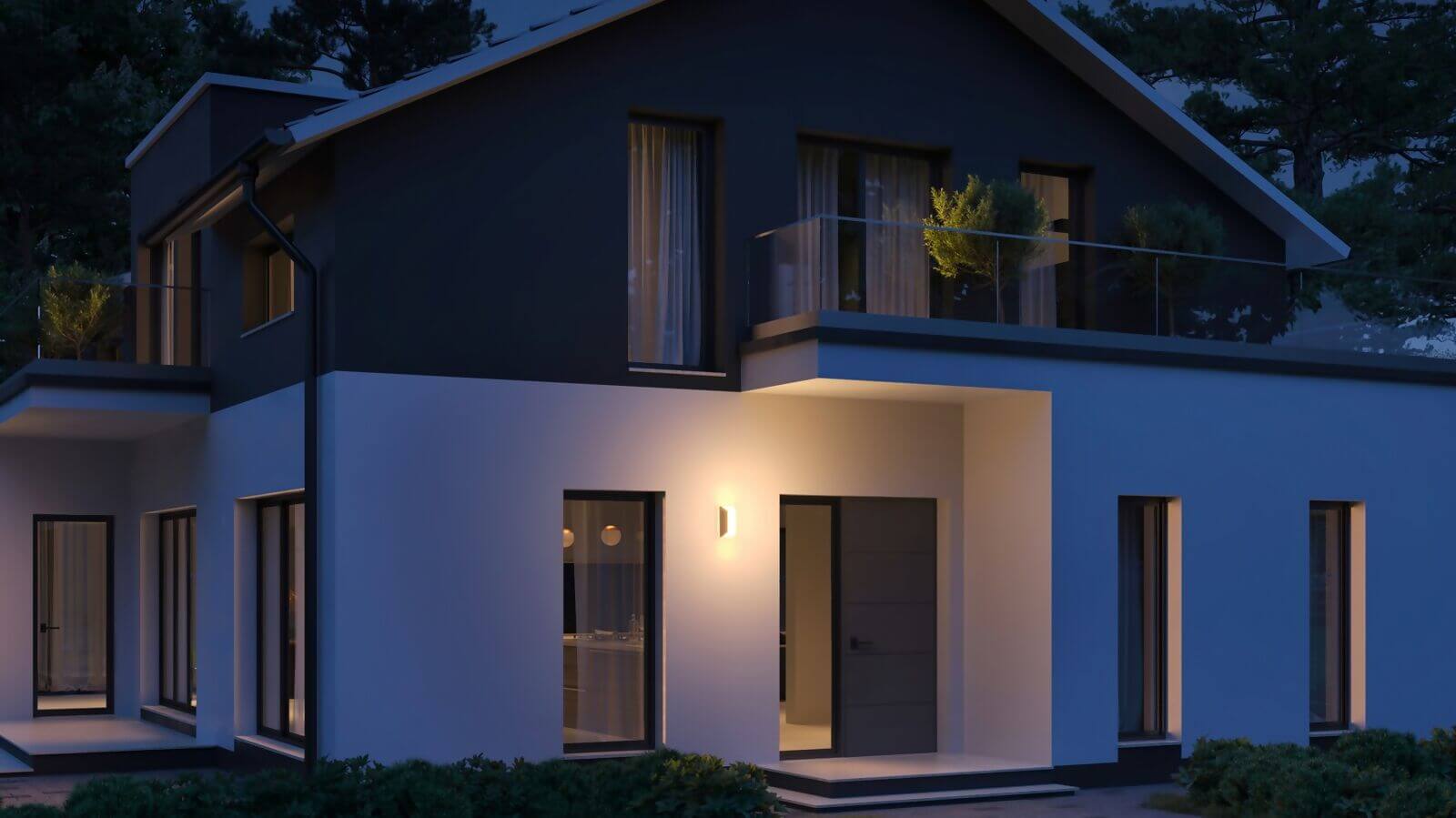 Steinel L 30 outdoor wall light illuminating a modern house exterior at dusk, showcasing its stylish design.
