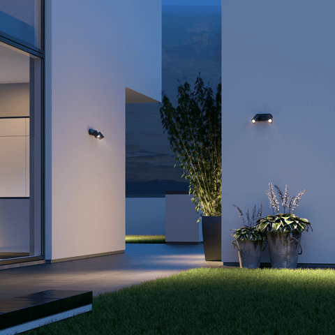 Steinel Spot Duo S Sensor Spotlight illuminating a modern outdoor space at dusk with sleek design and premium build.