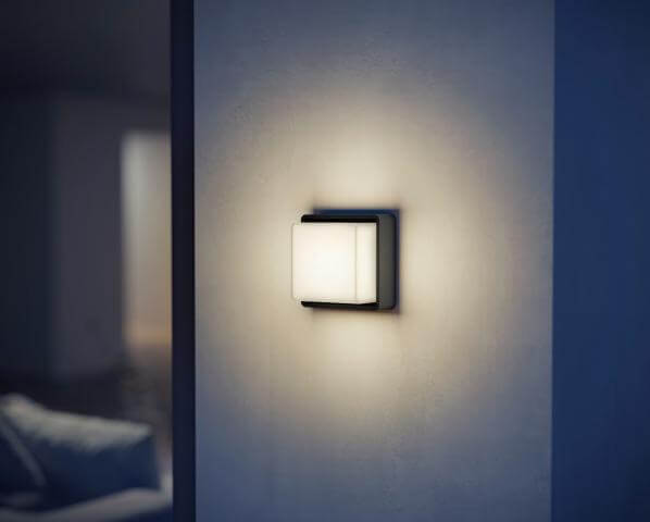Sleek Steinel L 845 C Bluetooth outdoor wall light with cubic design, providing warm LED illumination in modern spaces.