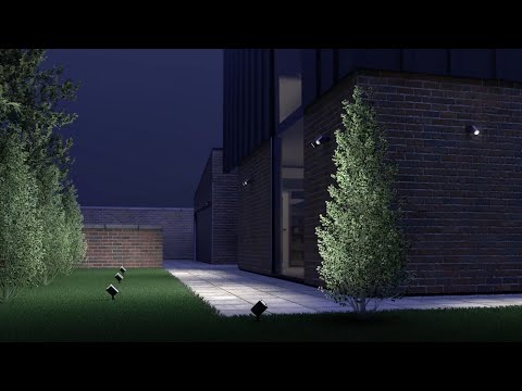 Load video: Steinel Spot Duo S sensor spotlight illuminating a modern outdoor space with stylish design and greenery.